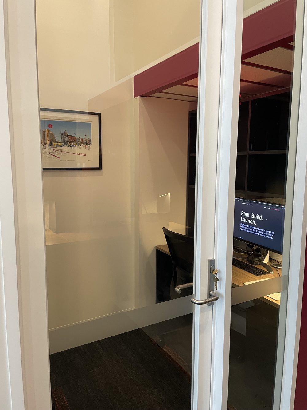 Private office at Enterprise-P — lockable glass door showing a private office